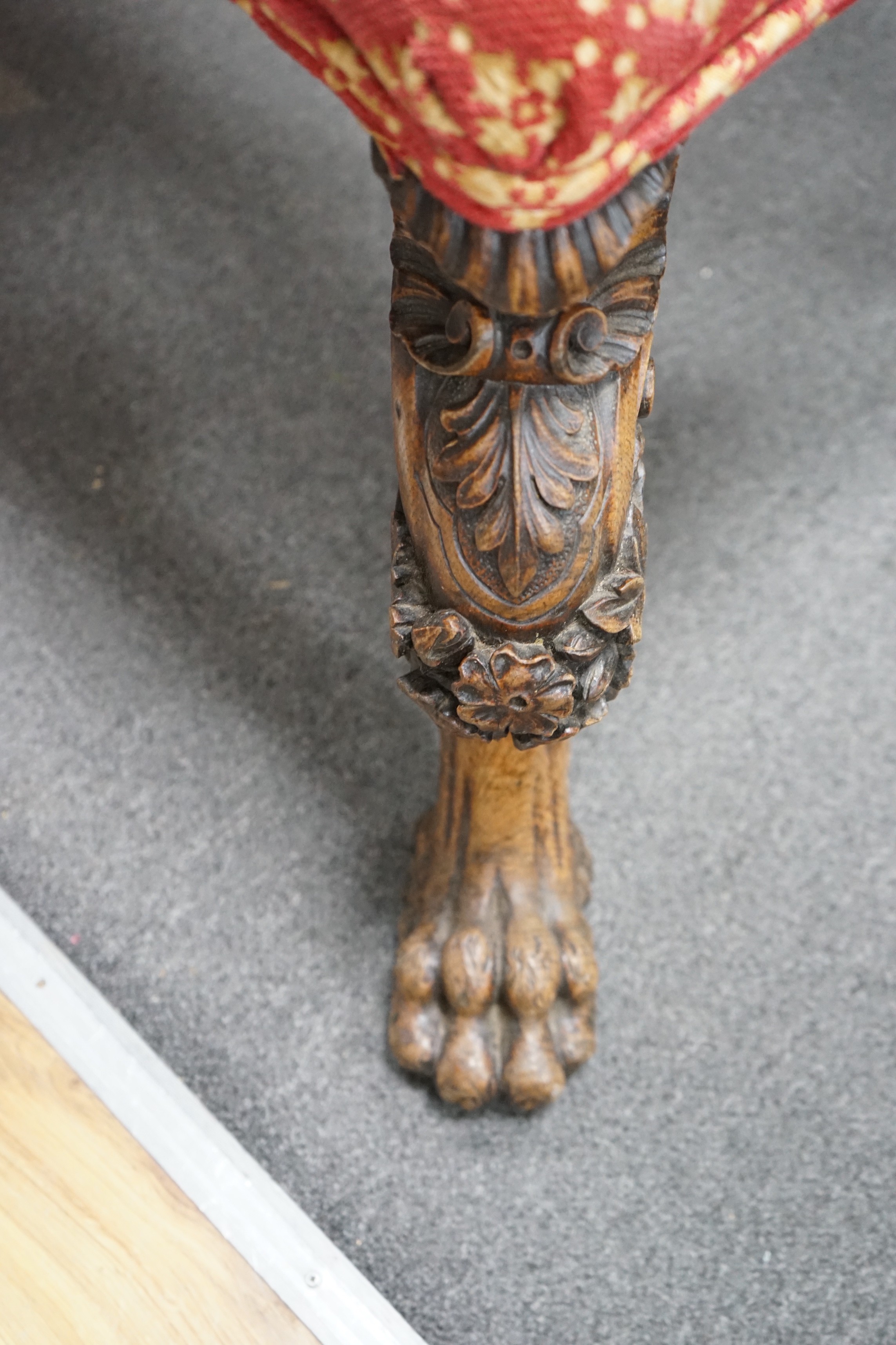 A Victorian window seat with carved oak lions paw feet, length 140cm, depth 62cm, height 48cm